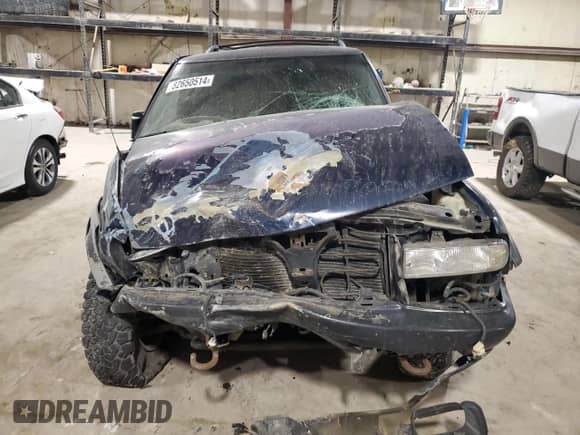 2001 Chevrolet Blazer LS z VIN 1GNCT18W01K143093, wystawiony jako Copart lot #82650514 z przebiegiem Nie podano mil oraz Szkoda całkowita • Salvage title. Historia ofert i sprzedaży dostępna na DreamBid. Obrazek 5.
