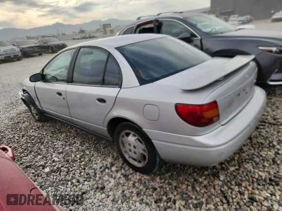 2000 Saturn SL with VIN 1G8ZH5284YZ240606, listed as a Copart auction lot 80808315 with 206,722 mi miles and Salvage title. Bid and sale history available at DreamBid. Image 2.