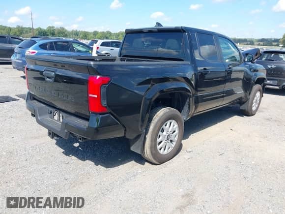 2024 Toyota Tacoma SR5 with VIN 3TMLB5JN7RM077957, listed as a IAAI auction lot 43149381 with 11,806 mi miles and . Bid and sale history available at DreamBid. Image 4.