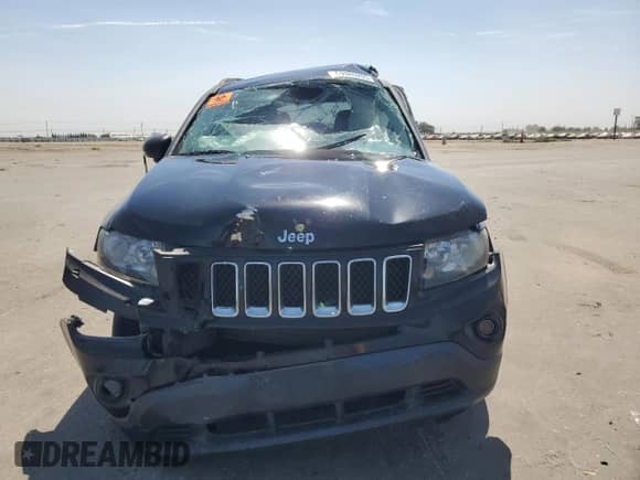 2014 Jeep Compass Sport with VIN 1C4NJCBA9ED925595, listed as a Copart auction lot 69980205 with 115,857 mi miles and Salvage title. Bid and sale history available at DreamBid. Image 5.