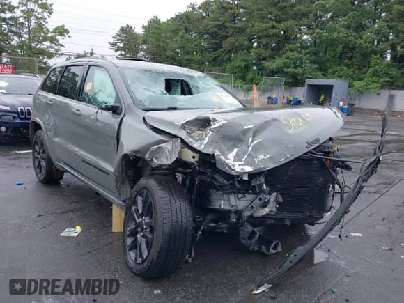 2021 Jeep Grand Cherokee Laredo X with VIN 1C4RJFAG2MC589415, listed as a IAAI auction lot 42514387 with 66,033 mi miles and . Bid and sale history available at DreamBid. Image 6.