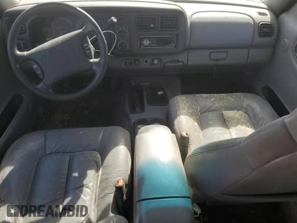 1999 Dodge Durango with VIN 1B4HS28Z1XF528727, listed as a Copart auction lot 77621824 with 164,880 mi miles and Salvage title. Bid and sale history available at DreamBid. Image 8.