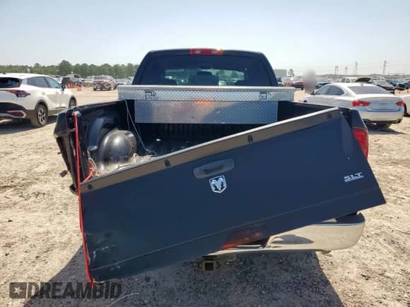2006 Dodge 1500 SLT z VIN 1D7HA18P06J212526, wystawiony jako Copart lot #66889415 z przebiegiem 257 558 mil mil oraz Szkoda całkowita • Salvage title. Historia ofert i sprzedaży dostępna na DreamBid. Obrazek 6.