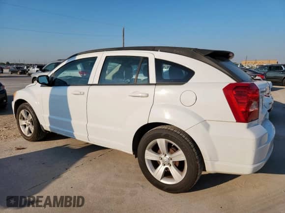 2011 Dodge Caliber Mainstreet z VIN 1B3CB3HA6BD254136, wystawiony jako Copart lot #82222795 z przebiegiem 101 121 mil mil oraz Czysty tytuł • Clean title. Historia ofert i sprzedaży dostępna na DreamBid. Obrazek 2.