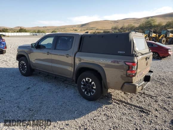 2024 Nissan Frontier Pro-4X with VIN 1N6ED1EK4RN622270, listed as a Copart auction lot 81142545 with 6,749 mi miles and Salvage title. Bid and sale history available at DreamBid. Image 2.