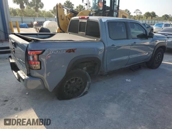 2022 Nissan Frontier Pro-4X z VIN 1N6ED1EK5NN692886, wystawiony jako Copart lot #48501315 z przebiegiem 20 895 mil mil oraz Szkoda całkowita • Salvage title. Historia ofert i sprzedaży dostępna na DreamBid. Obrazek 3.