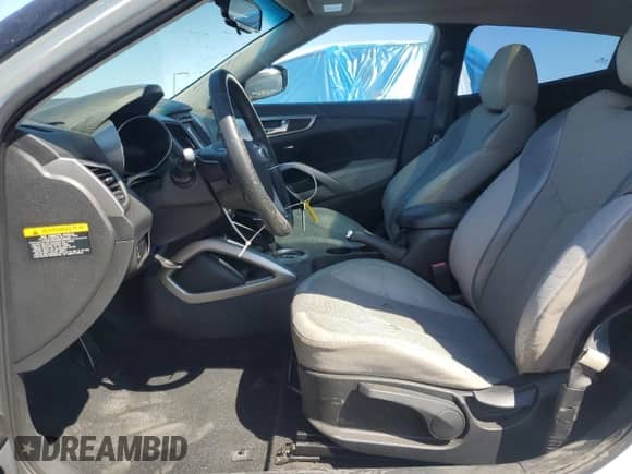 2012 Hyundai Veloster w/Black Int z VIN KMHTC6AD1CU037673, wystawiony jako Copart lot #71550475 z przebiegiem 204 000 mil mil oraz Szkoda całkowita • Salvage title. Historia ofert i sprzedaży dostępna na DreamBid. Obrazek 7.