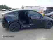 2024 Tesla Model Y with VIN 7SAYGDED8RF156984, listed as a IAAI auction lot 43324819 with 26,941 mi miles and . Bid and sale history available at DreamBid. Image 6.
