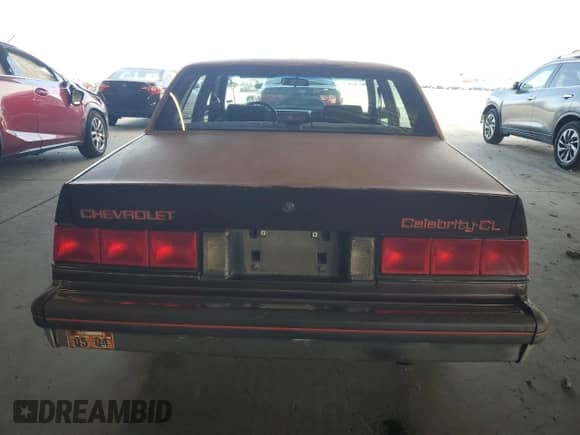 1987 Chevrolet Celebrity с VIN 1G1AW51W1H6122810, выставлен на аукционе Copart как лот 69521625 с пробегом 85 826 миль миль и Чистый • Clean title. История ставок и продаж доступна на DreamBid. Изображение 6.
