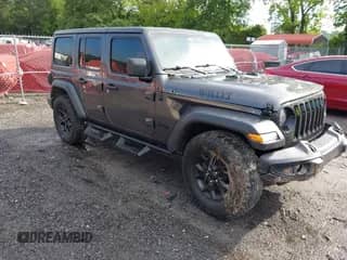 2021 Jeep Wrangler Unlimited Willys with VIN 1C4HJXDG2MW646904, listed as a IAAI auction lot 42267506 with 55,530 mi miles and . Bid and sale history available at DreamBid. Image 1.