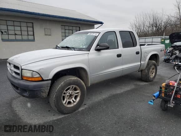 2003 Dodge Dakota Sport z VIN 1D7HG38X43S212335, wystawiony jako Copart lot #85670114 z przebiegiem 161 851 mil mil oraz Szkoda całkowita • Salvage title. Historia ofert i sprzedaży dostępna na DreamBid. Obrazek 1.