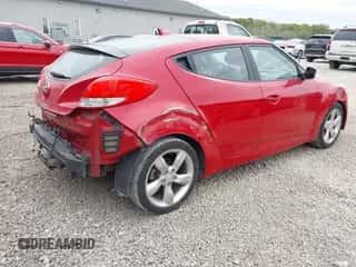 2013 Hyundai Veloster w/Black Int z VIN KMHTC6AD7DU129100, wystawiony jako IAAI lot #43459342 z przebiegiem 98 170 mil mil oraz . Historia ofert i sprzedaży dostępna na DreamBid. Obrazek 4.
