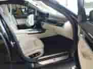 2019 BMW 7 Series 750i with VIN WBA7F0C55KGM24477, listed as a IAAI auction lot 42883182 with 76,932 mi miles and . Bid and sale history available at DreamBid. Image 5.