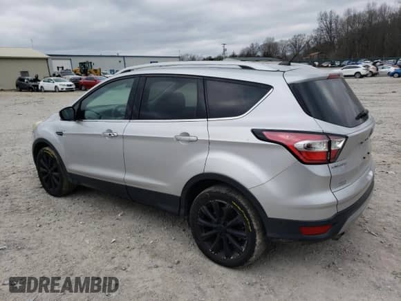 2017 Ford Escape Titanium с VIN 1FMCU0JD9HUD04723, выставлен на аукционе Copart как лот 87801365 с пробегом 126 452 миль миль и Списание • Salvage title. История ставок и продаж доступна на DreamBid. Изображение 2.