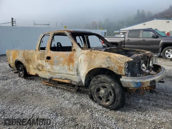 2000 Ford F-150 XL with VIN 1FTRX18L2YNC34422, listed as a Copart auction lot 71864455 with Not provided miles and Salvage title. Bid and sale history available at DreamBid. Image 4.