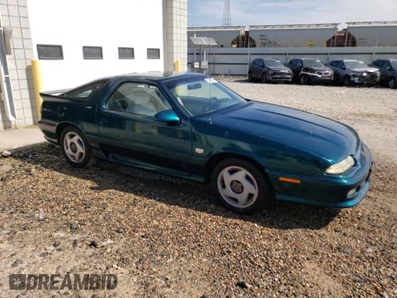 1993 Dodge Daytona with VIN 1B3XW64AXPN590208, listed as a Copart auction lot 71482934 with 131,876 mi miles and Salvage title. Bid and sale history available at DreamBid. Image 4.