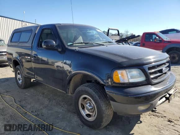 2002 Ford F-150 XL z VIN 1FTRF18232NA58109, wystawiony jako Copart lot #79080674 z przebiegiem 148 213 mil mil oraz Szkoda całkowita • Salvage title. Historia ofert i sprzedaży dostępna na DreamBid. Obrazek 4.