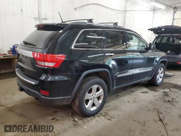 2012 Jeep Grand Cherokee Limited z VIN 1C4RJFBT9CC249950, wystawiony jako Copart lot #68299315 z przebiegiem 218 587 mil mil oraz Szkoda całkowita • Salvage title. Historia ofert i sprzedaży dostępna na DreamBid. Obrazek 3.