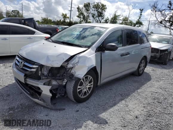 2015 Honda Odyssey LX with VIN 5FNRL5H22FB025431, listed as a Copart auction lot 82373215 with 112,487 mi miles and Salvage title. Bid and sale history available at DreamBid. Image 1.
