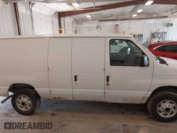 2014 Ford Econoline Cargo Commercial with VIN 1FTNE2EW8EDA09190, listed as a IAAI auction lot 42655816 with 212,534 mi miles and . Bid and sale history available at DreamBid. Image 13.