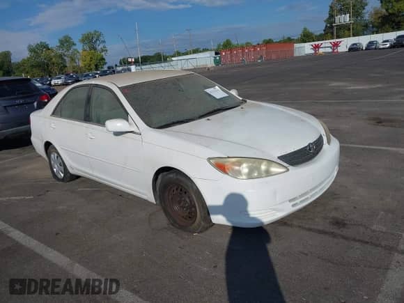 2004 Toyota Camry LE with VIN 4T1BE32K14U324837, listed as a IAAI auction lot 43132115 with 180,230 mi miles and . Bid and sale history available at DreamBid. Image 1.
