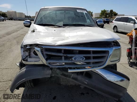 2002 Ford F-150 XLT с VIN 1FTRW07612KC06709, выставлен на аукционе Copart как лот 61016915 с пробегом Не указан миль и Списание • Salvage title. История ставок и продаж доступна на DreamBid. Изображение 5.