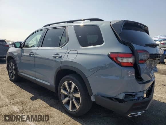 2024 Honda Pilot Touring с VIN 5FNYG2H70RB015527, выставлен на аукционе Copart как лот 59353985 с пробегом 21 461 миль миль и Списание • Salvage title. История ставок и продаж доступна на DreamBid. Изображение 2.