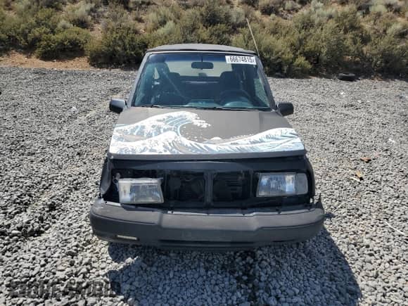 1996 Chevrolet Tracker with VIN 2CNBE186XT6919987, listed as a Copart auction lot 66674815 with 176,986 mi miles and Salvage title. Bid and sale history available at DreamBid. Image 5.
