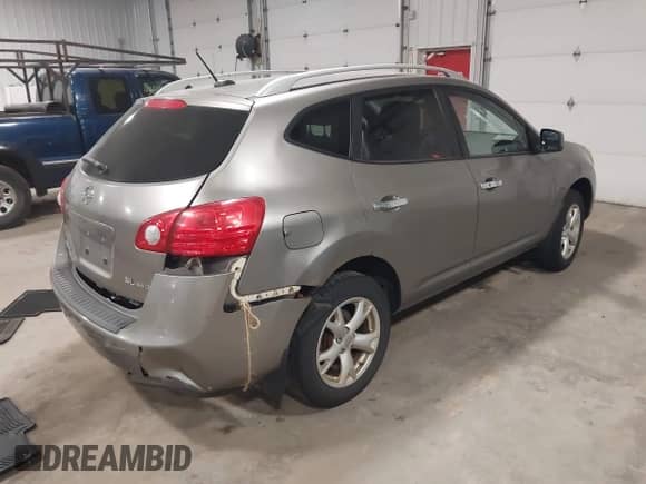 2010 Nissan Rogue S with VIN JN8AS5MV6AW142826, listed as a IAAI auction lot 43211959 with 118,458 mi miles and . Bid and sale history available at DreamBid. Image 4.