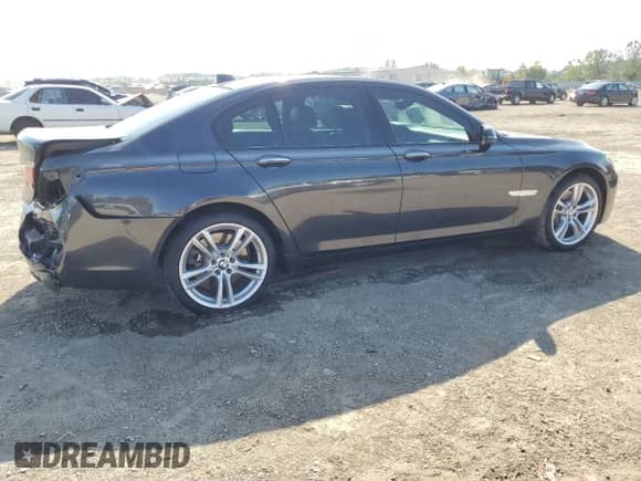 2014 BMW 7 Series 750i xDrive with VIN WBAYB6C54ED224456, listed as a Copart auction lot 71027795 with 104,442 mi miles and Salvage title. Bid and sale history available at DreamBid. Image 3.