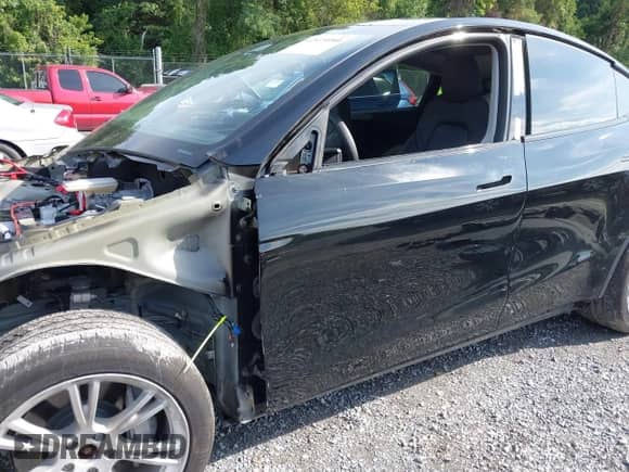 2023 Tesla Model Y Long Range with VIN 7SAYGDEE7PF825882, listed as a IAAI auction lot 42975990 with 44,109 mi miles and . Bid and sale history available at DreamBid. Image 21.
