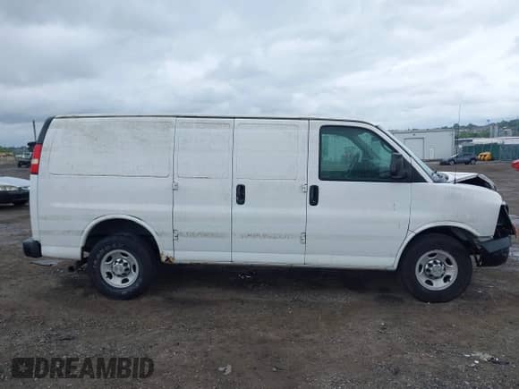 2012 Chevrolet Express Cargo with VIN 1GCWGFFA8C1108597, listed as a IAAI auction lot 42323808 with 200,965 mi miles and . Bid and sale history available at DreamBid. Image 12.