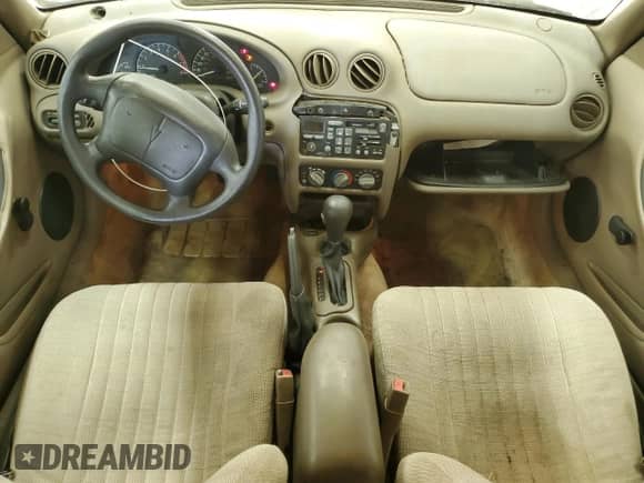 1998 Pontiac Grand Am SE with VIN 1G2NE52T3WM506391, listed as a Copart auction lot 57699325 with 79,508 mi miles and Salvage title. Bid and sale history available at DreamBid. Image 8.