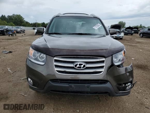 2012 Hyundai Santa Fe SE с VIN 5XYZHDAG9CG155048, выставлен на аукционе Copart как лот 71070065 с пробегом Не указан миль и Списание • Salvage title. История ставок и продаж доступна на DreamBid. Изображение 5.