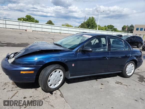 1997 Saturn SL with VIN 1G8ZK5271VZ288861, listed as a Copart auction lot 80120265 with 260,488 mi miles and Salvage title. Bid and sale history available at DreamBid. Image 1.