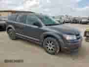 2015 Dodge Journey American Value with VIN 3C4PDCAB0FT618466, listed as a Copart auction lot 82071415 with 129,058 mi miles and Salvage title. Bid and sale history available at DreamBid. Image 4.