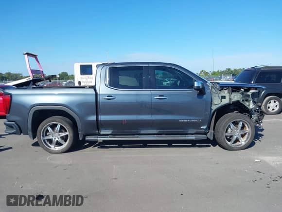 2019 GMC Sierra 1500 Denali z VIN 3GTU9FED7KG169405, wystawiony jako IAAI lot #43343060 z przebiegiem 75 199 mil mil oraz . Historia ofert i sprzedaży dostępna na DreamBid. Obrazek 14.