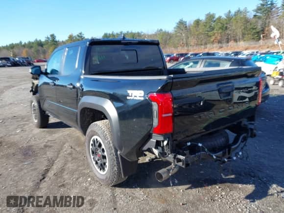 2024 Toyota Tacoma SR5 with VIN 3TMLB5JN0RM008463, listed as a IAAI auction lot 40979020 with 4,710 mi miles and . Bid and sale history available at DreamBid. Image 3.