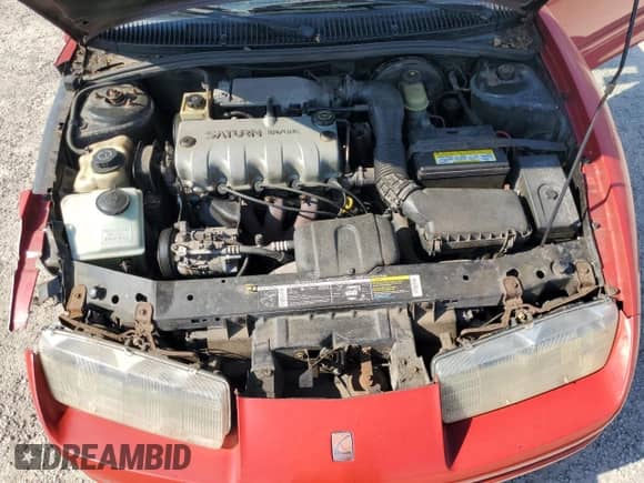 1995 Saturn SC with VIN 1G8ZE1285SZ141155, listed as a Copart auction lot 65757374 with 150,973 mi miles and Salvage title. Bid and sale history available at DreamBid. Image 11.