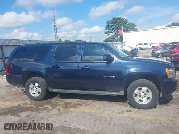 2007 Chevrolet Suburban LT with VIN 1GNFC16077J244819, listed as a IAAI auction lot 42823003 with 186,301 mi miles and . Bid and sale history available at DreamBid. Image 13.