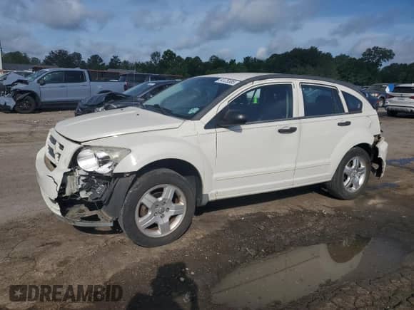 2008 Dodge Caliber SXT with VIN 1B3HB48C48D590860, listed as a Copart auction lot 54125585 with 242,177 mi miles and Salvage title. Bid and sale history available at DreamBid. Image 1.