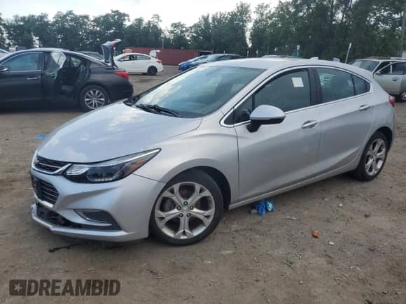 2018 Chevrolet Cruze Premier с VIN 3G1BF6SM3JS648221, выставлен на аукционе Copart как лот 63764555 с пробегом 60 212 миль миль и Списание • Salvage title. История ставок и продаж доступна на DreamBid. Изображение 1.