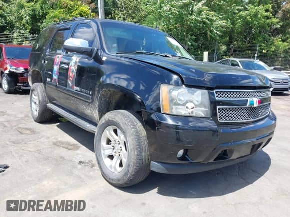 2007 Chevrolet Tahoe LTZ z VIN 1GNFK13037J354144, wystawiony jako IAAI lot #42335769 z przebiegiem 232 458 mil mil oraz . Historia ofert i sprzedaży dostępna na DreamBid. Obrazek 1.
