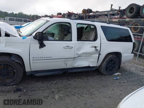2009 Chevrolet Suburban LTZ z VIN 1GNFK36359R256609, wystawiony jako IAAI lot #42799458 z przebiegiem 146 257 mil mil oraz . Historia ofert i sprzedaży dostępna na DreamBid. Obrazek 14.