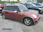 2006 MINI Hardtop with VIN WMWRC33526TK66647, listed as a Copart auction lot 81100025 with 179,203 mi miles and Salvage title. Bid and sale history available at DreamBid. Image 4.