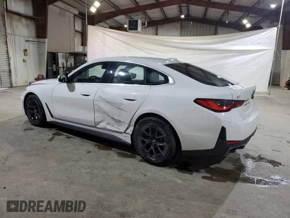 2022 BMW i4 eDrive40 с VIN WBY73AW0XNFM42502, выставлен на аукционе Copart как лот 57509235 с пробегом 25 001 миль миль и Списание • Salvage title. История ставок и продаж доступна на DreamBid. Изображение 2.