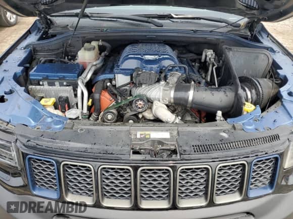 2018 Jeep Grand Cherokee Trackhawk z VIN 1C4RJFN92JC318555, wystawiony jako Copart lot #60436545 z przebiegiem 58 628 mil mil oraz Czysty tytuł • Clean title. Historia ofert i sprzedaży dostępna na DreamBid. Obrazek 12.