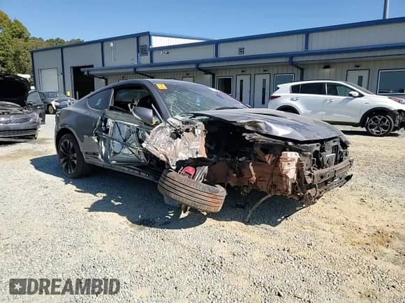 2015 Hyundai Genesis Coupe R-Spec with VIN KMHHU6KJ5FU122785, listed as a Copart auction lot 77006244 with Not provided miles and Salvage title. Bid and sale history available at DreamBid. Image 11.