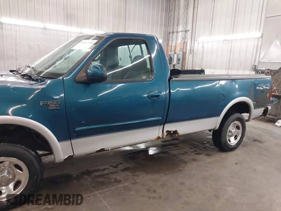 2000 Ford F-150 XL z VIN 1FTRF18W2YNC32960, wystawiony jako IAAI lot #42487779 z przebiegiem 126 416 mil mil oraz . Historia ofert i sprzedaży dostępna na DreamBid. Obrazek 13.