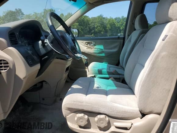 2004 Honda Odyssey LX with VIN 5FNRL18534B143388, listed as a Copart auction lot 68346135 with 160,563 mi miles and Salvage title. Bid and sale history available at DreamBid. Image 7.
